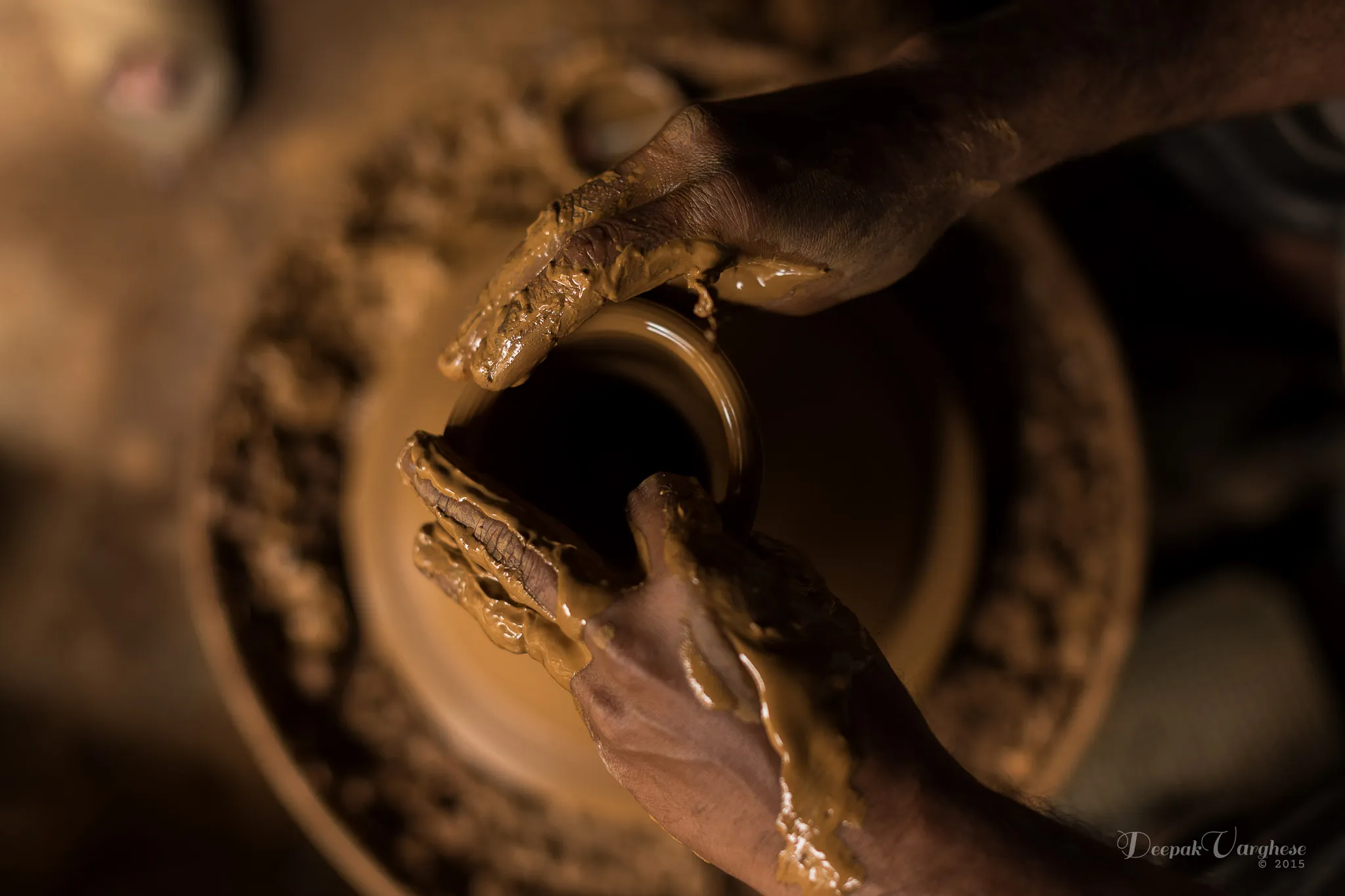 Potter working on wheel close-up
