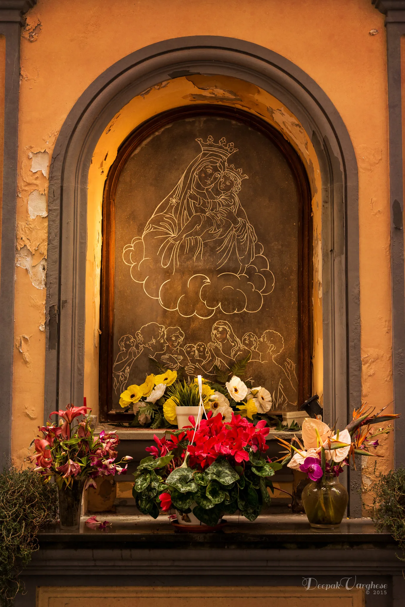Italian Madonna shrine with flowers