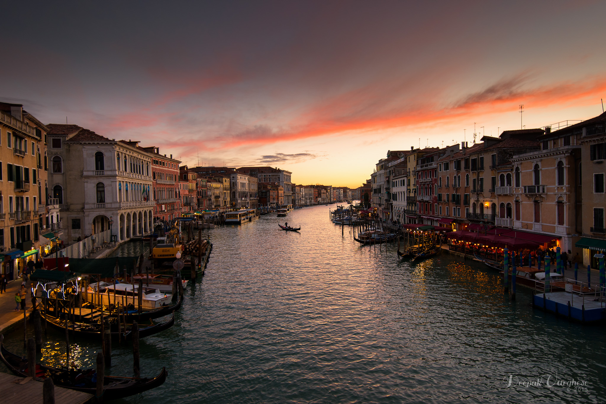 Venice canal at dusk with warm light on historic facades